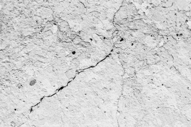 Çatlakları ve çizikleri olan beton bir duvarın dokusu arka plan olarak kullanılabilir.