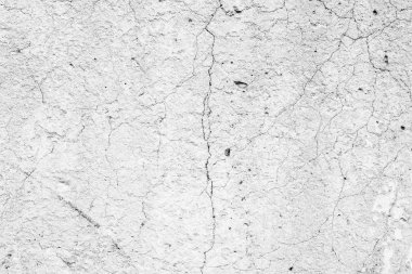 Çatlakları ve çizikleri olan beton bir duvarın dokusu arka plan olarak kullanılabilir.