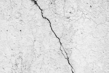 Çatlakları ve çizikleri olan beton bir duvarın dokusu arka plan olarak kullanılabilir.