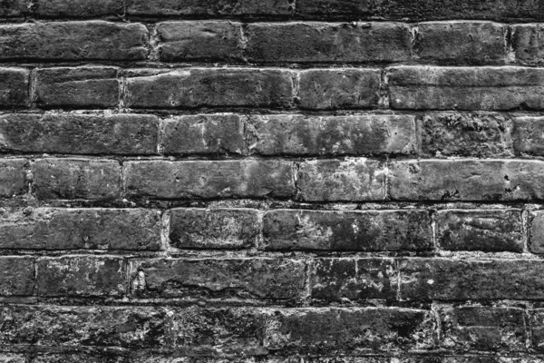 stock image Texture of a brick wall with cracks and scratches which can be used as a background