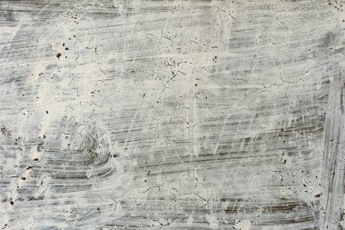 Çatlakları ve çizikleri olan beton bir duvarın dokusu arka plan olarak kullanılabilir.