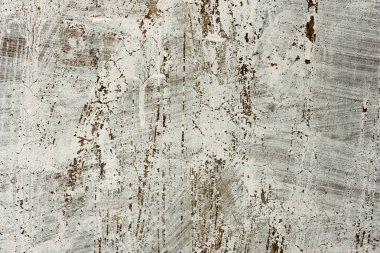 Çatlakları ve çizikleri olan beton bir duvarın dokusu arka plan olarak kullanılabilir.