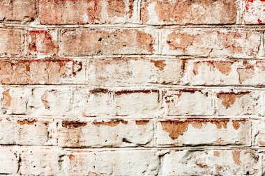 Çatlakları ve çizikleri olan tuğla duvar dokusu arka plan olarak kullanılabilir.