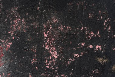 Çatlakları ve çizikleri olan beton bir duvarın dokusu arka plan olarak kullanılabilir.