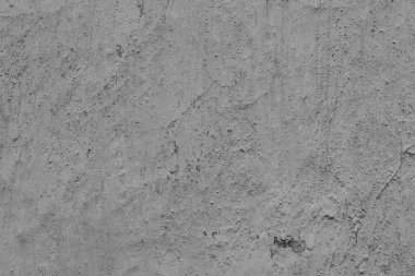 Çatlakları ve çizikleri olan beton bir duvarın dokusu arka plan olarak kullanılabilir.