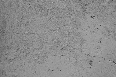 Çatlakları ve çizikleri olan beton bir duvarın dokusu arka plan olarak kullanılabilir.