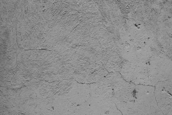 Çatlakları ve çizikleri olan beton bir duvarın dokusu arka plan olarak kullanılabilir.