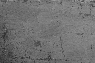 Çatlakları ve çizikleri olan beton bir duvarın dokusu arka plan olarak kullanılabilir.