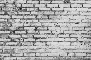 Çatlakları ve çizikleri olan tuğla duvar dokusu arka plan olarak kullanılabilir.