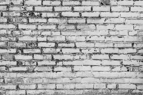 Çatlakları ve çizikleri olan tuğla duvar dokusu arka plan olarak kullanılabilir.