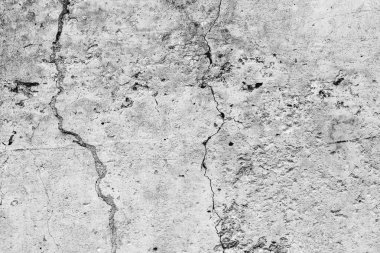 Çatlakları ve çizikleri olan beton bir duvarın dokusu arka plan olarak kullanılabilir.
