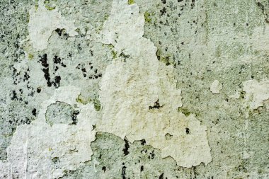 Çatlakları ve çizikleri olan beton bir duvarın dokusu arka plan olarak kullanılabilir.