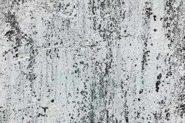 Çatlakları ve çizikleri olan beton bir duvarın dokusu arka plan olarak kullanılabilir.