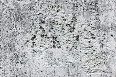 Çatlakları ve çizikleri olan beton bir duvarın dokusu arka plan olarak kullanılabilir.