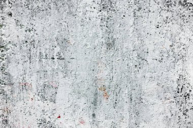 Çatlakları ve çizikleri olan beton bir duvarın dokusu arka plan olarak kullanılabilir.