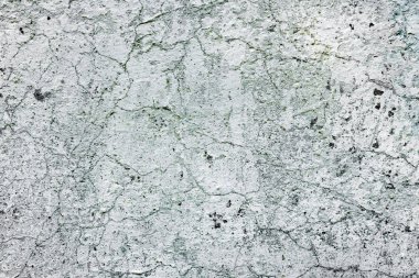 Çatlakları ve çizikleri olan beton bir duvarın dokusu arka plan olarak kullanılabilir.