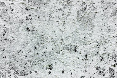 Çatlakları ve çizikleri olan beton bir duvarın dokusu arka plan olarak kullanılabilir.