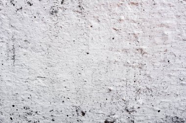Çatlakları ve çizikleri olan beton bir duvarın dokusu arka plan olarak kullanılabilir.