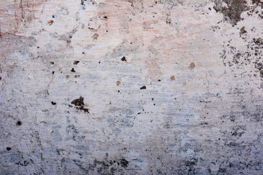 Çatlakları ve çizikleri olan beton bir duvarın dokusu arka plan olarak kullanılabilir.