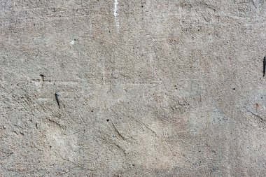 Çatlakları ve çizikleri olan beton bir duvarın dokusu arka plan olarak kullanılabilir.