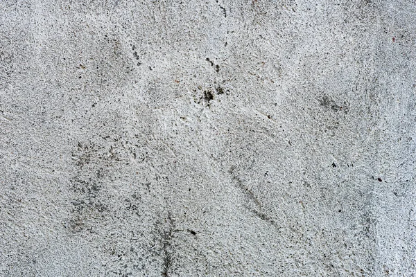 Çatlakları ve çizikleri olan beton bir duvarın dokusu arka plan olarak kullanılabilir.