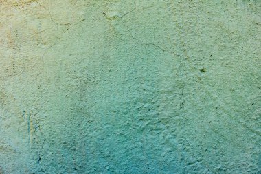 Çatlakları ve çizikleri olan beton bir duvarın dokusu arka plan olarak kullanılabilir.