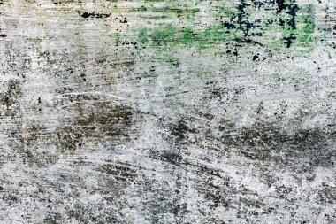 Çatlakları ve çizikleri olan beton bir duvarın dokusu arka plan olarak kullanılabilir.