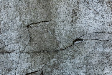 Çatlakları ve çizikleri olan tuğla duvar dokusu arka plan olarak kullanılabilir.
