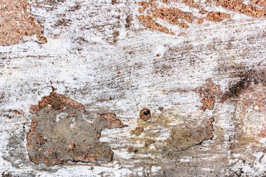 Çatlakları ve çizikleri olan tuğla duvar dokusu arka plan olarak kullanılabilir.