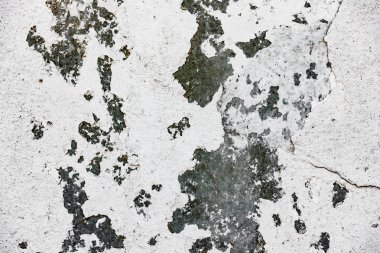 Çatlakları ve çizikleri olan beton bir duvarın dokusu arka plan olarak kullanılabilir.