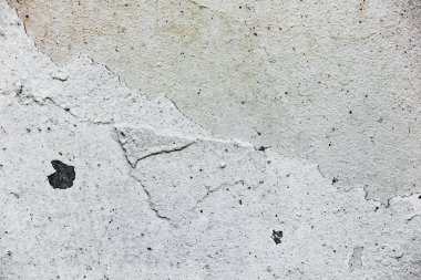 Çatlakları ve çizikleri olan beton bir duvarın dokusu arka plan olarak kullanılabilir.