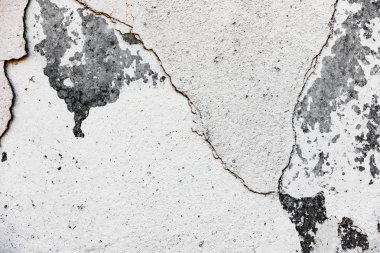 Çatlakları ve çizikleri olan beton bir duvarın dokusu arka plan olarak kullanılabilir.