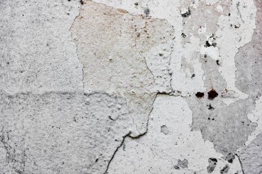 Çatlakları ve çizikleri olan beton bir duvarın dokusu arka plan olarak kullanılabilir.
