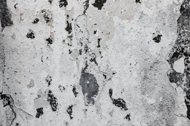 Çatlakları ve çizikleri olan beton bir duvarın dokusu arka plan olarak kullanılabilir.