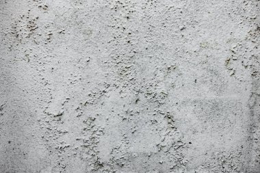 Çatlakları ve çizikleri olan beton bir duvarın dokusu arka plan olarak kullanılabilir.