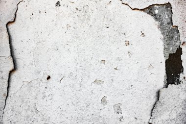 Çatlakları ve çizikleri olan beton bir duvarın dokusu arka plan olarak kullanılabilir.