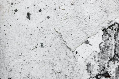 Çatlakları ve çizikleri olan beton bir duvarın dokusu arka plan olarak kullanılabilir.
