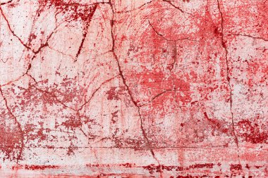 Çatlakları ve çizikleri olan beton bir duvarın dokusu arka plan olarak kullanılabilir.