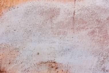 Çatlakları ve çizikleri olan beton bir duvarın dokusu arka plan olarak kullanılabilir.