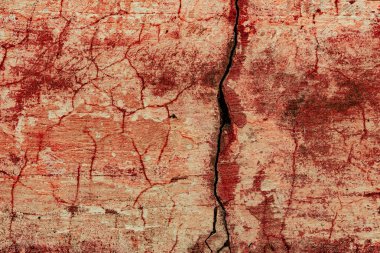 Çatlakları ve çizikleri olan beton bir duvarın dokusu arka plan olarak kullanılabilir.