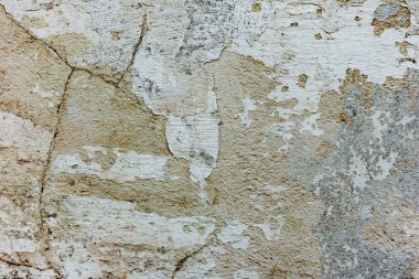 Çatlakları ve çizikleri olan beton bir duvarın dokusu arka plan olarak kullanılabilir.