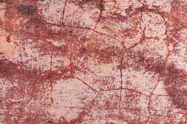 Çatlakları ve çizikleri olan beton bir duvarın dokusu arka plan olarak kullanılabilir.