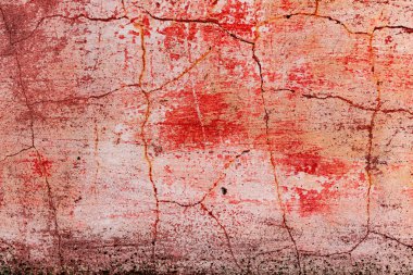 Çatlakları ve çizikleri olan beton bir duvarın dokusu arka plan olarak kullanılabilir.