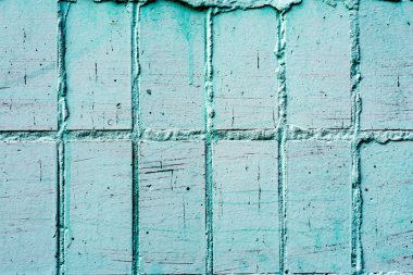 Çatlakları ve çizikleri olan tuğla duvar dokusu arka plan olarak kullanılabilir.