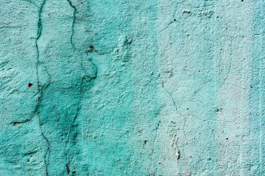 Çatlakları ve çizikleri olan beton bir duvarın dokusu arka plan olarak kullanılabilir.