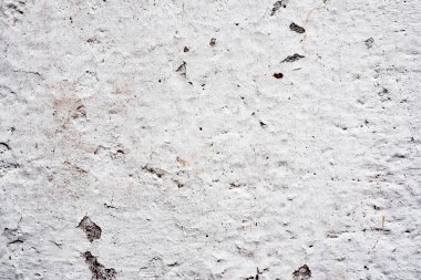 Çatlakları ve çizikleri olan beton bir duvarın dokusu arka plan olarak kullanılabilir.