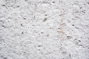 Çatlakları ve çizikleri olan beton bir duvarın dokusu arka plan olarak kullanılabilir.