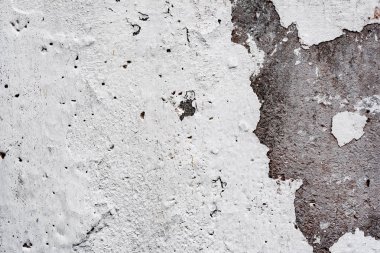 Çatlakları ve çizikleri olan beton bir duvarın dokusu arka plan olarak kullanılabilir.