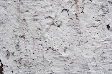 Çatlakları ve çizikleri olan beton bir duvarın dokusu arka plan olarak kullanılabilir.