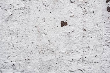 Çatlakları ve çizikleri olan beton bir duvarın dokusu arka plan olarak kullanılabilir.